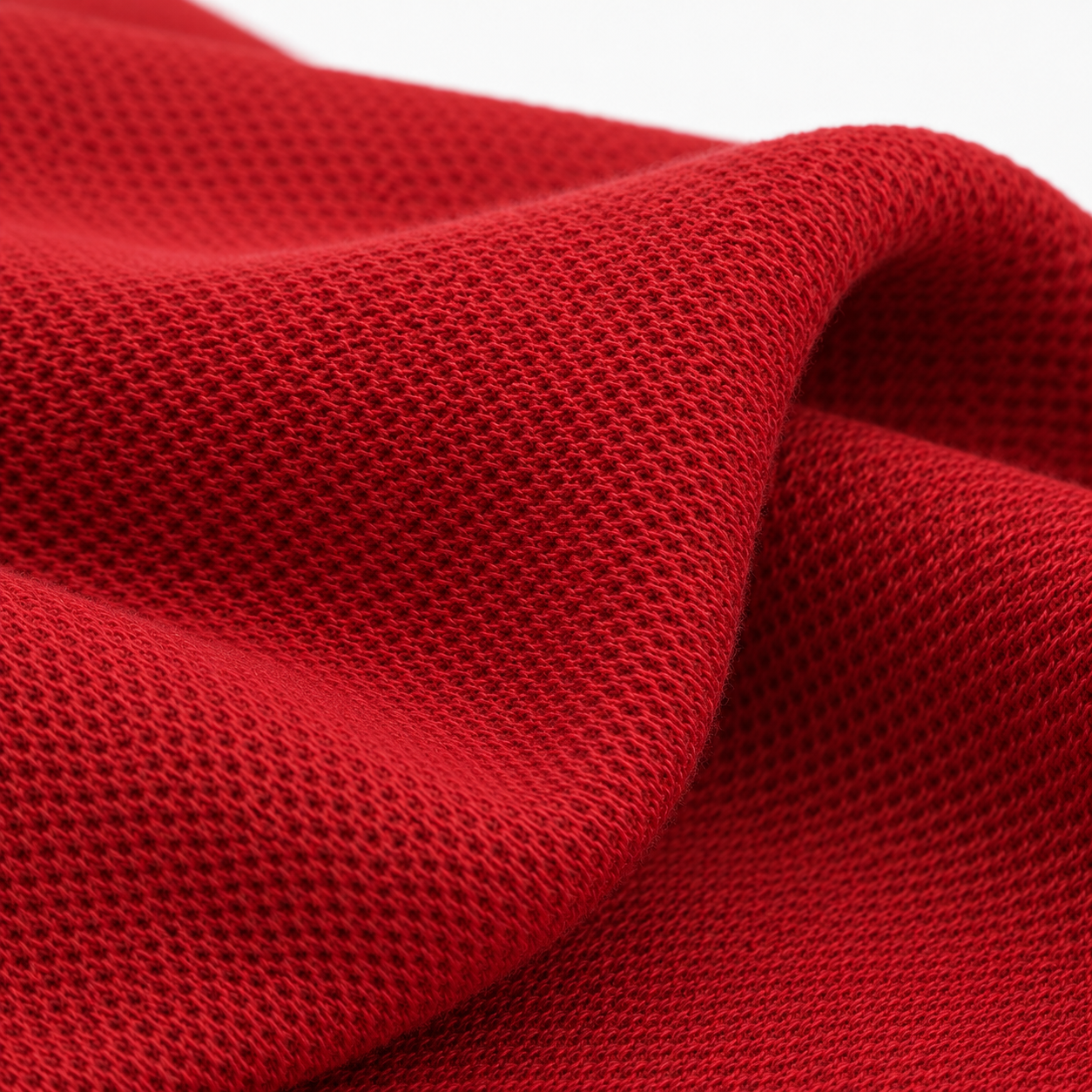 Tecido vermelho com textura piquet usado nos uniformes Profile